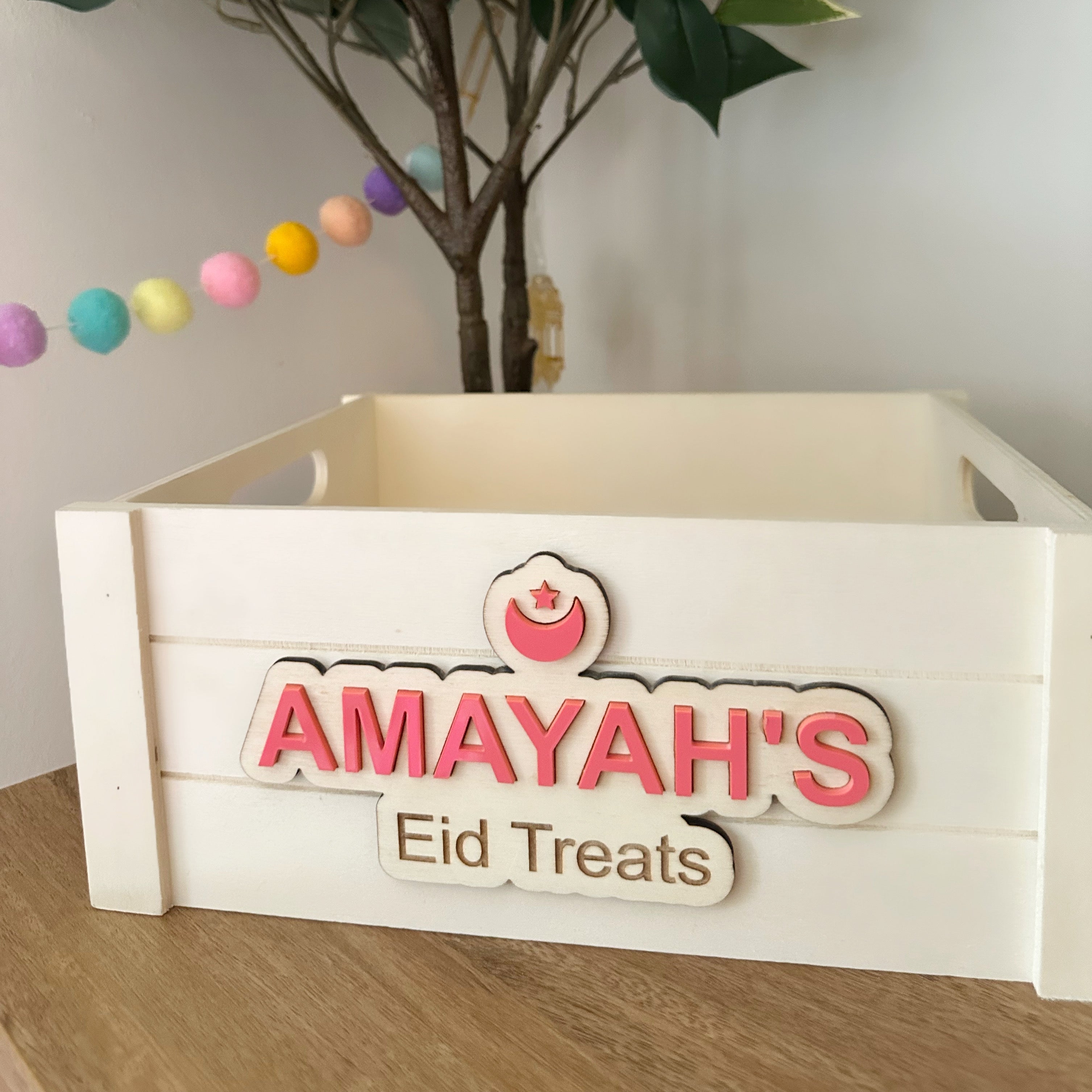 A wooden, personalised, Eid Treats gifting crate/box, perfect for presenting Eid gifts to Muslim children during Ramadan/on Eid.